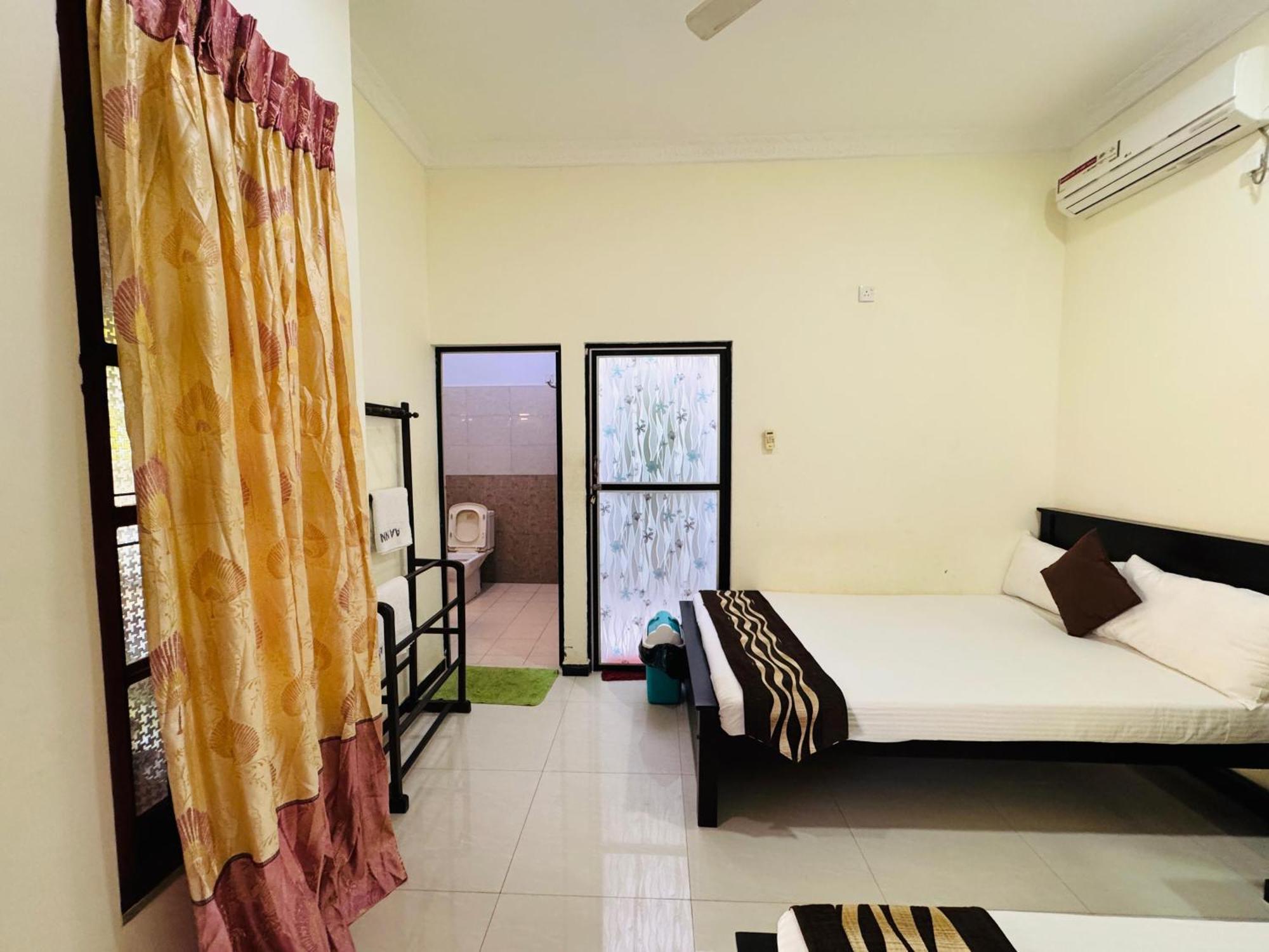 Aa Inn تريكونامالاي الغرفة الصورة